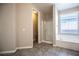 Bright bathroom featuring walk-in shower and a soaking tub with a window at 703 Flaming Cliffs Ct, Henderson, NV 89014