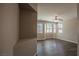 Large bedroom with wood-look flooring, many windows and neutral walls at 703 Flaming Cliffs Ct, Henderson, NV 89014
