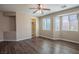 Spacious bedroom with wood-look flooring and windows letting in natural light at 703 Flaming Cliffs Ct, Henderson, NV 89014