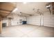 Spacious garage with storage cabinets and a ladder at 703 Flaming Cliffs Ct, Henderson, NV 89014