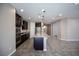 Kitchen features an island with granite countertops and stainless steel appliances at 703 Flaming Cliffs Ct, Henderson, NV 89014