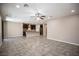 Open-concept floor plan features modern kitchen and living room with tile flooring at 703 Flaming Cliffs Ct, Henderson, NV 89014