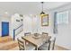 Dining area with a modern table, four chairs, and stylish decor near the front entry at 7364 N Decatur Blvd # 4, Las Vegas, NV 89131