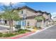 Townhome exterior features a private garage, well-maintained landscaping, and a welcoming entrance at 7364 N Decatur Blvd # 4, Las Vegas, NV 89131