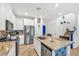 Bright kitchen featuring granite countertops, stainless steel appliances, and a large island at 7364 N Decatur Blvd # 4, Las Vegas, NV 89131