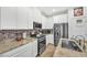 Well-equipped kitchen features stainless steel appliances, granite countertops, and stylish backsplash at 7364 N Decatur Blvd # 4, Las Vegas, NV 89131