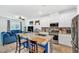Open-concept kitchen features a large island with seating and stainless steel appliances at 7364 N Decatur Blvd # 4, Las Vegas, NV 89131