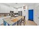 Bright kitchen features granite countertops, stainless steel appliances, and white cabinetry at 7364 N Decatur Blvd # 4, Las Vegas, NV 89131