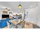 Bright open-concept living space with kitchen, dining area, and modern furnishings in neutral tones at 7364 N Decatur Blvd # 4, Las Vegas, NV 89131