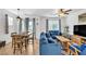 Inviting living room featuring a dining table, sofas, and a stylish entertainment center at 7364 N Decatur Blvd # 4, Las Vegas, NV 89131