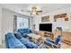Comfortable living room features plush seating, a ceiling fan, and ample natural light at 7364 N Decatur Blvd # 4, Las Vegas, NV 89131
