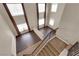 High-ceiling entryway with a chandelier, open staircase and hardwood floors at 7715 Villa De La Paz Ave, Las Vegas, NV 89131