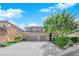 Charming two-story home with a three-car garage, landscaped yard, and inviting curb appeal at 7715 Villa De La Paz Ave, Las Vegas, NV 89131