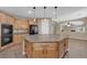 The kitchen includes a large island, lots of storage, granite counters and stainless appliances at 7715 Villa De La Paz Ave, Las Vegas, NV 89131