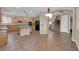 Open kitchen showcases a large island, tile floors, stainless steel appliances, and plenty of cabinet space at 7715 Villa De La Paz Ave, Las Vegas, NV 89131