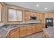 This spacious kitchen has an island, granite counters, and lots of cabinet space at 7715 Villa De La Paz Ave, Las Vegas, NV 89131