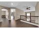 Loft area with a staircase and an open floor plan, seamlessly connecting to other rooms at 7715 Villa De La Paz Ave, Las Vegas, NV 89131