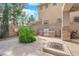 Outdoor space featuring a built-in grill station, fire pit, and custom stone elements at 7715 Villa De La Paz Ave, Las Vegas, NV 89131