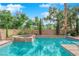 Sparkling swimming pool and spa nestled in a landscaped backyard for ultimate relaxation at 7715 Villa De La Paz Ave, Las Vegas, NV 89131