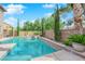 Beautiful swimming pool and spa with lush landscaping, perfect for relaxation and entertainment at 7715 Villa De La Paz Ave, Las Vegas, NV 89131