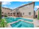 Backyard oasis features a sparkling pool, raised spa, and patio for outdoor enjoyment at 7715 Villa De La Paz Ave, Las Vegas, NV 89131