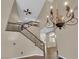 Staircase with metal banister overlooking a large living space with soaring ceilings at 7715 Villa De La Paz Ave, Las Vegas, NV 89131