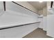 Walk-in closet featuring built-in shelving and carpet floors at 7715 Villa De La Paz Ave, Las Vegas, NV 89131
