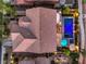 Overhead view of this property with a shimmering pool, spa, patio area, and neatly landscaped yard, offering privacy and relaxation at 8429 Brackenfield Ave, Las Vegas, NV 89178