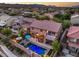Amazing aerial shot of this property with a stunning pool, spa, patio area, and well-maintained landscaping at 8429 Brackenfield Ave, Las Vegas, NV 89178