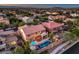 Aerial view of a home with a sparkling pool, spa, covered patio, and landscaped yard in a desirable neighborhood at 8429 Brackenfield Ave, Las Vegas, NV 89178