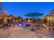 Stunning backyard with a sparkling pool, spa, lounge chairs, pergola, and lush landscaping, perfect for outdoor entertaining at 8429 Brackenfield Ave, Las Vegas, NV 89178