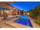 Beautiful backyard featuring a pool, spa, fire bowls, outdoor seating, and a covered patio, creating a relaxing oasis at 8429 Brackenfield Ave, Las Vegas, NV 89178