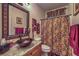 Bathroom showcasing a vessel sink on granite countertop, and shower with decorative curtain at 8429 Brackenfield Ave, Las Vegas, NV 89178