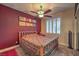 Cozy bedroom featuring a ceiling fan, shuttered window, and carpet flooring at 8429 Brackenfield Ave, Las Vegas, NV 89178