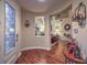 Inviting foyer with wood floors, decorative lighting, and doorway to the formal living room at 8429 Brackenfield Ave, Las Vegas, NV 89178