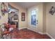 Elegant foyer with wood floors, decorative art, and a view into the adjacent office at 8429 Brackenfield Ave, Las Vegas, NV 89178