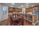 Spacious kitchen with wood cabinets, stainless appliances, large island, and breakfast bar at 8429 Brackenfield Ave, Las Vegas, NV 89178