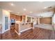Kitchen with granite countertops, breakfast bar, and built in appliances adjacent to Gathering room at 8429 Brackenfield Ave, Las Vegas, NV 89178