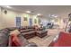 Spacious living area with plush sofa, carpeting, shuttered windows, and ample natural light at 8429 Brackenfield Ave, Las Vegas, NV 89178