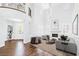 Bright, open living room with fireplace, tall ceilings, and modern decor provides a welcoming space at 8429 Brackenfield Ave, Las Vegas, NV 89178