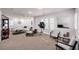 Spacious and well-lit living room with stylish decor and large windows offering a welcoming ambiance at 8429 Brackenfield Ave, Las Vegas, NV 89178
