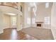 Bright living room with high ceilings, fireplace, and lots of natural light from the many windows at 8429 Brackenfield Ave, Las Vegas, NV 89178