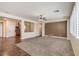 Spacious living room with ceiling fan and large window at 8429 Brackenfield Ave, Las Vegas, NV 89178