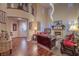 Open concept living room with fireplace, wood floors and abundant natural light at 8429 Brackenfield Ave, Las Vegas, NV 89178