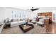 Inviting living room with ample seating, ceiling fan, and adjacent dining area at 8429 Brackenfield Ave, Las Vegas, NV 89178