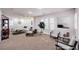 Open living room with neutral tones, comfortable seating, and abundant natural light at 8429 Brackenfield Ave, Las Vegas, NV 89178