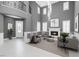 Bright, open living room with fireplace, tall ceilings, and modern decor provides a welcoming space at 8429 Brackenfield Ave, Las Vegas, NV 89178