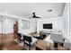 Spacious living room featuring a ceiling fan, media center and open floor plan at 8429 Brackenfield Ave, Las Vegas, NV 89178