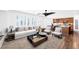 Inviting living room area flows into an open-concept kitchen with modern furnishings and natural light at 8429 Brackenfield Ave, Las Vegas, NV 89178