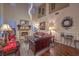 Inviting living room featuring a fireplace, stylish decor, and abundant natural light at 8429 Brackenfield Ave, Las Vegas, NV 89178